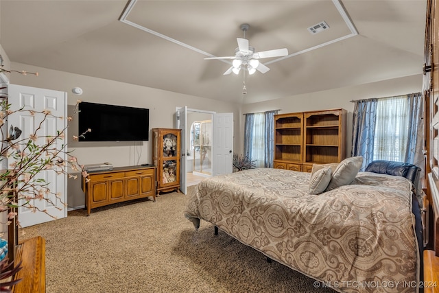 carpeted bedroom with connected bathroom, ceiling fan, and vaulted ceiling