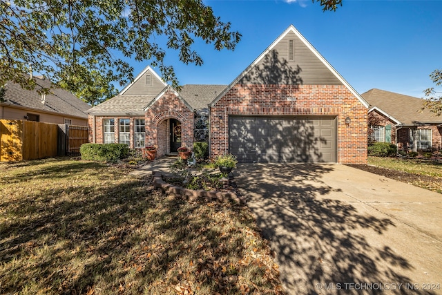 view of front facade with a front lawn and a garage