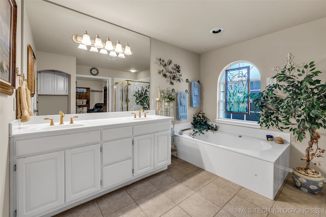 bathroom featuring tile patterned flooring, vanity, and independent shower and bath