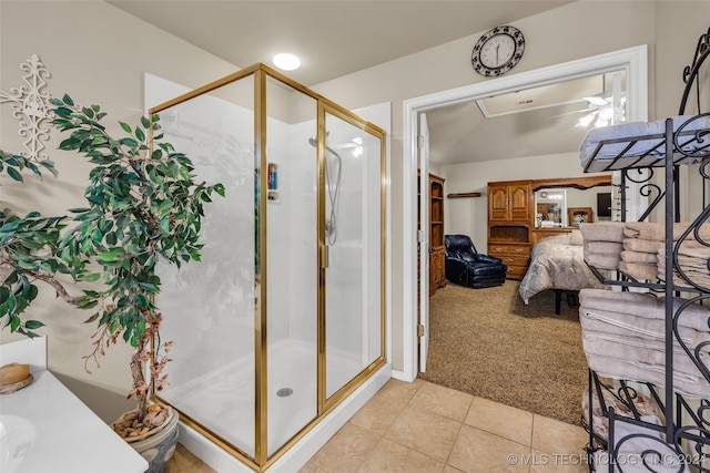 bathroom with tile patterned flooring and walk in shower