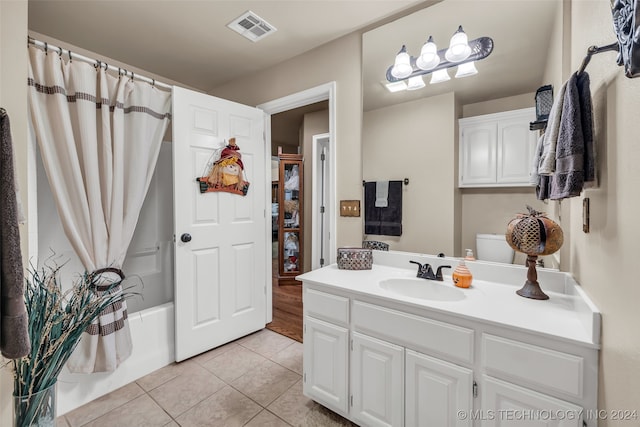 full bathroom with toilet, shower / bath combination with curtain, vanity, and tile patterned floors