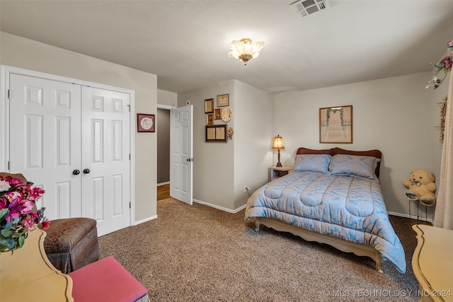 bedroom with carpet flooring and a closet