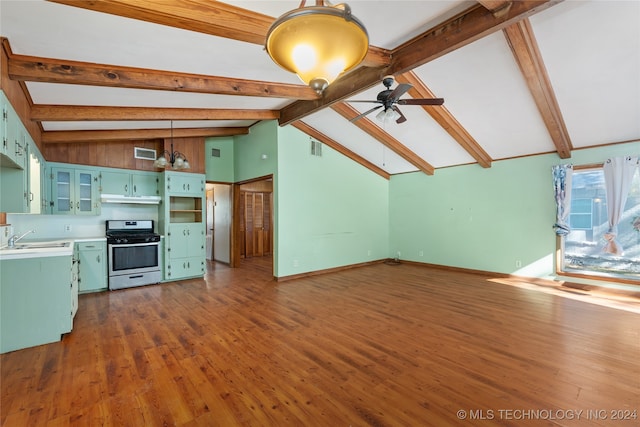 unfurnished living room with ceiling fan, high vaulted ceiling, beamed ceiling, dark wood-type flooring, and sink