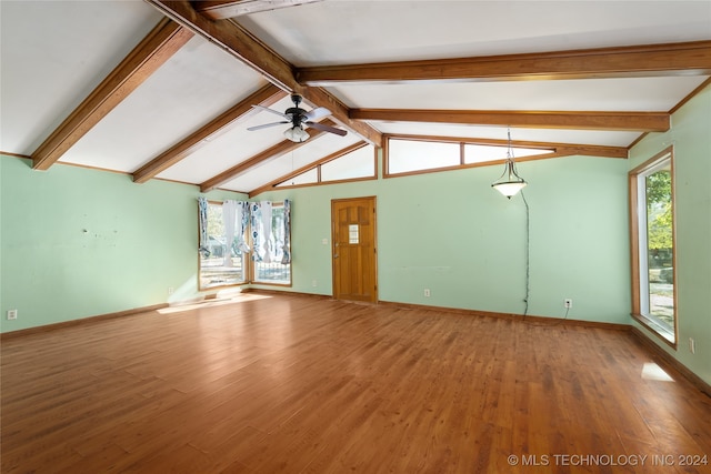 unfurnished living room with vaulted ceiling with beams, wood-type flooring, and ceiling fan