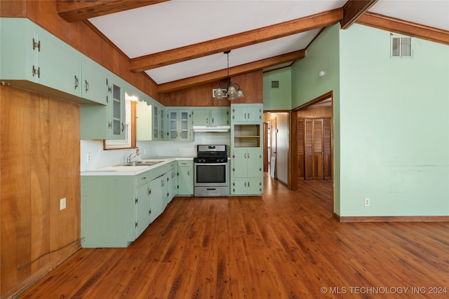 kitchen featuring a notable chandelier, stainless steel range with gas cooktop, beamed ceiling, and pendant lighting