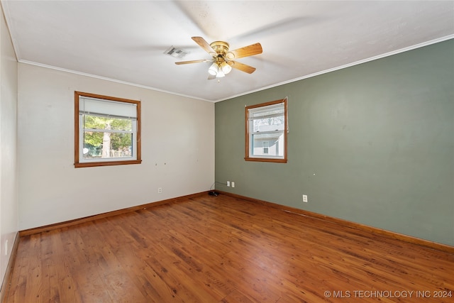 unfurnished room with ornamental molding, wood-type flooring, and ceiling fan