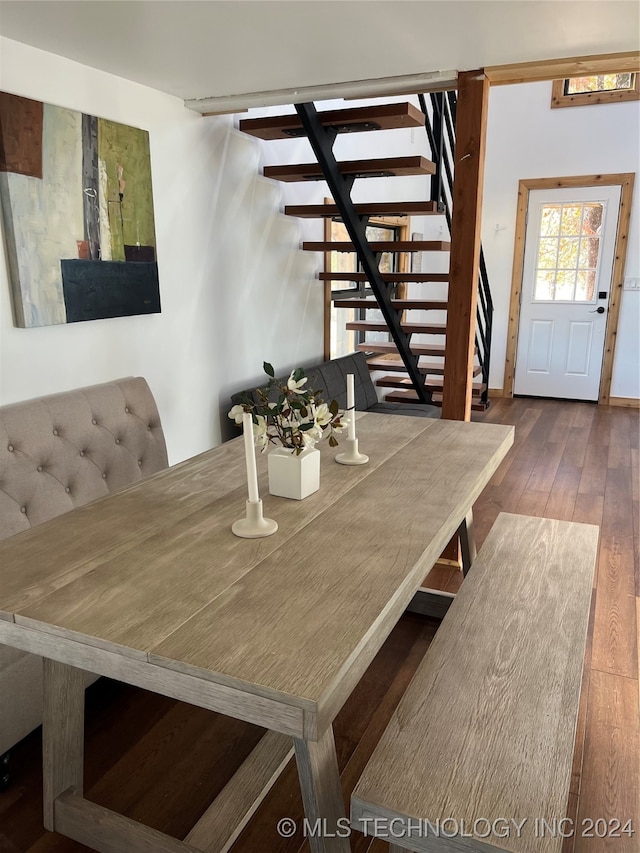 dining space with stairway and hardwood / wood-style floors