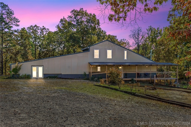 view of back house at dusk