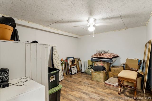 interior space with ceiling fan