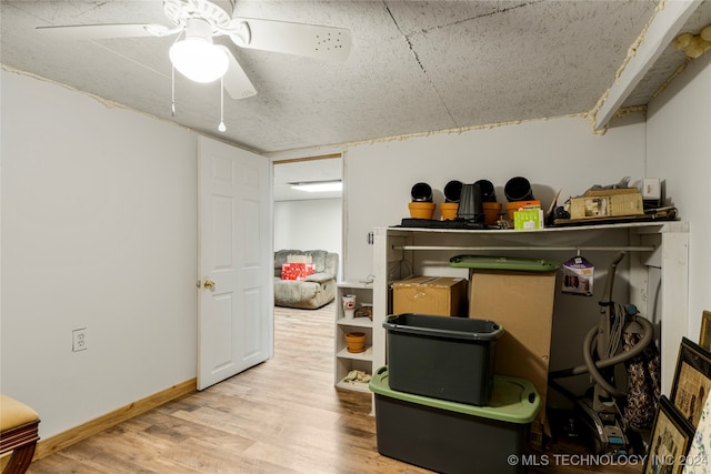 storage area featuring ceiling fan