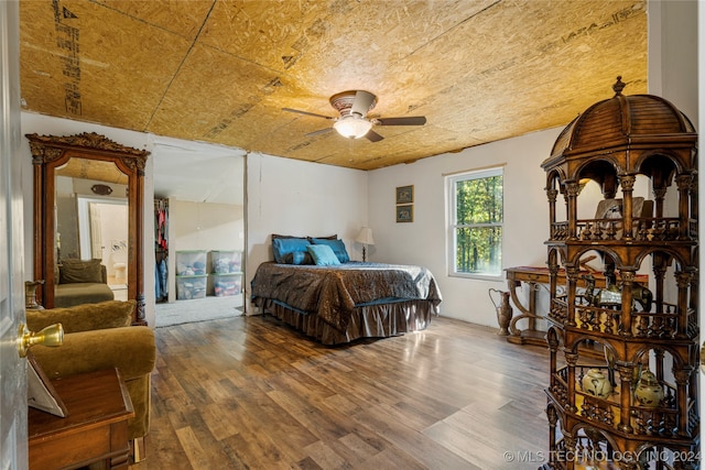 bedroom featuring hardwood / wood-style floors and ceiling fan