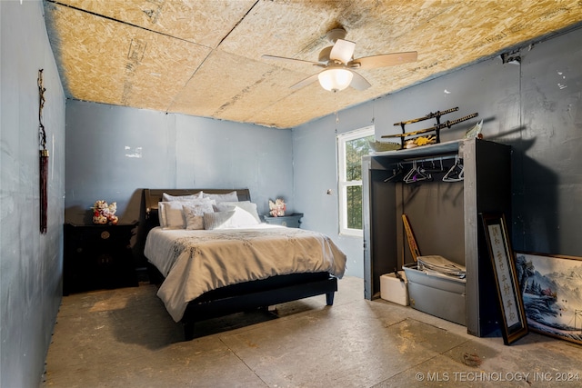 bedroom featuring concrete flooring and ceiling fan