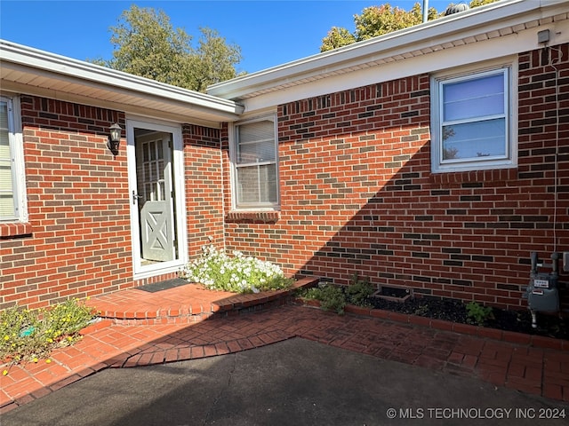 property entrance featuring a patio