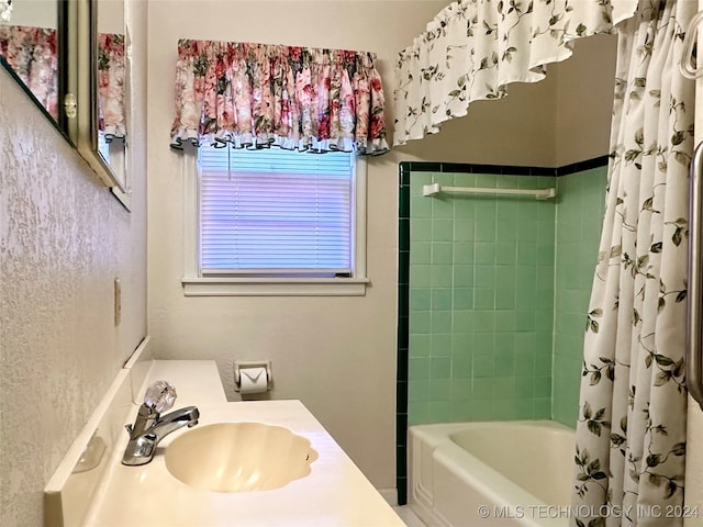 bathroom with vanity and shower / bath combo