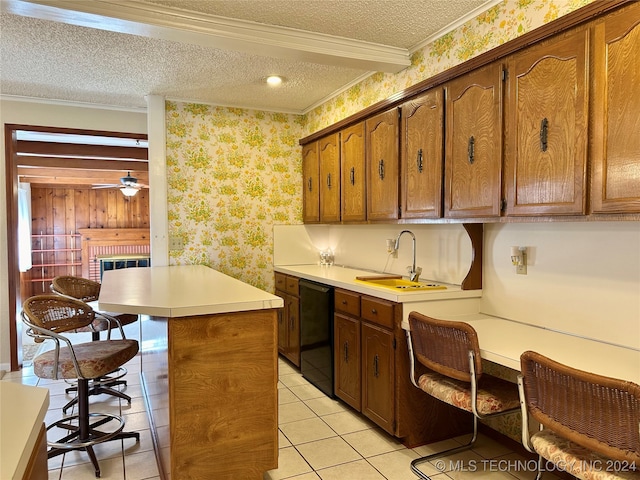 kitchen featuring a kitchen island, black dishwasher, a kitchen breakfast bar, ornamental molding, and a textured ceiling