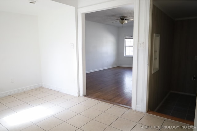 empty room featuring ceiling fan and light hardwood / wood-style flooring