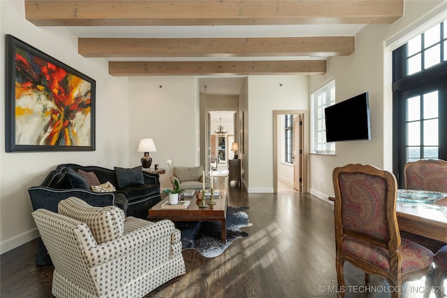 living room with beam ceiling, dark wood-type flooring, and a wealth of natural light