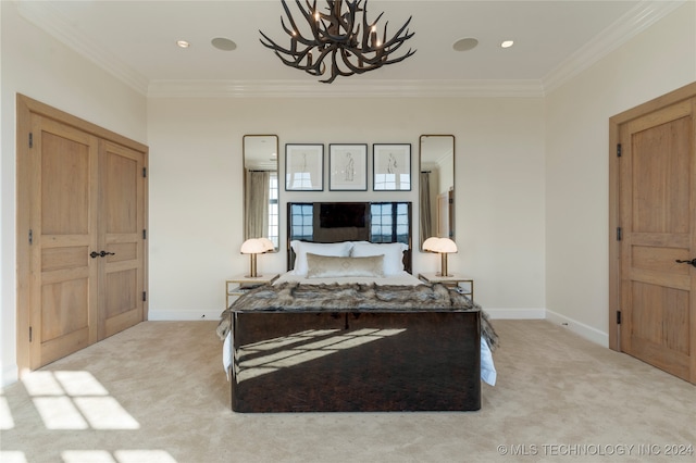 carpeted bedroom featuring a notable chandelier and ornamental molding