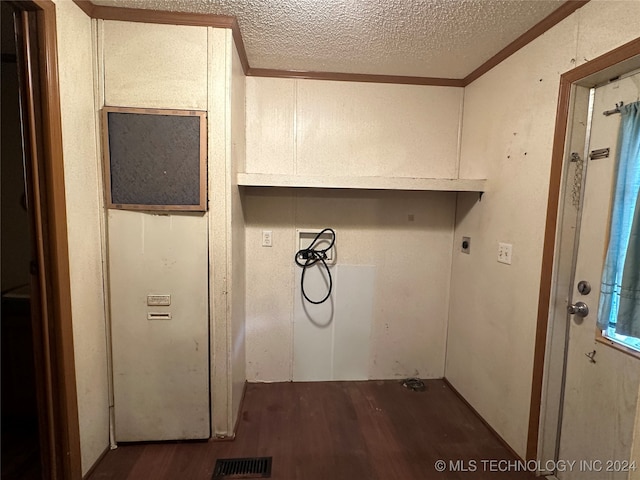 clothes washing area featuring hookup for a washing machine, dark hardwood / wood-style floors, crown molding, and electric dryer hookup