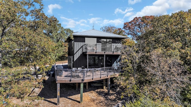 rear view of house featuring a deck