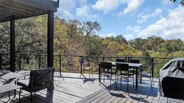 wooden terrace with a grill