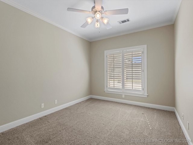 carpeted empty room featuring crown molding and ceiling fan