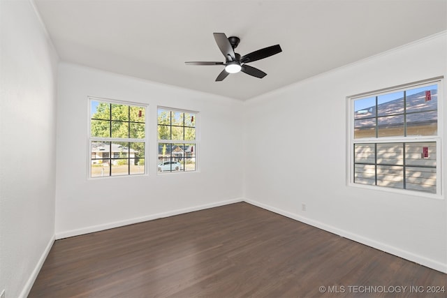 unfurnished room featuring crown molding, dark hardwood / wood-style floors, and ceiling fan