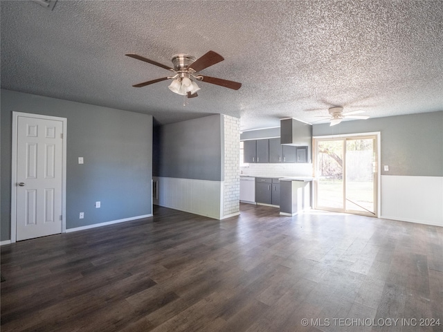 unfurnished living room featuring ceiling fan, dark hardwood / wood-style flooring, and a textured ceiling