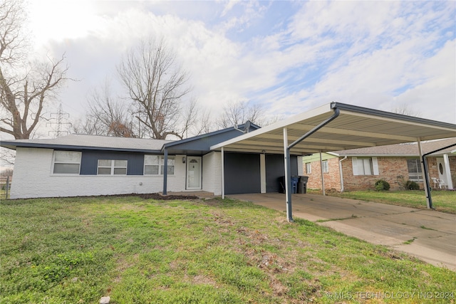 ranch-style home with a front lawn and a carport