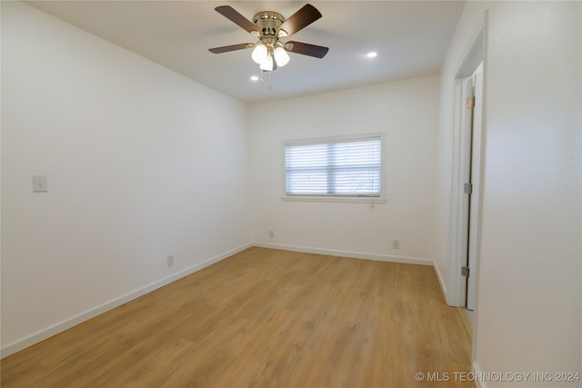 empty room with light hardwood / wood-style floors and ceiling fan