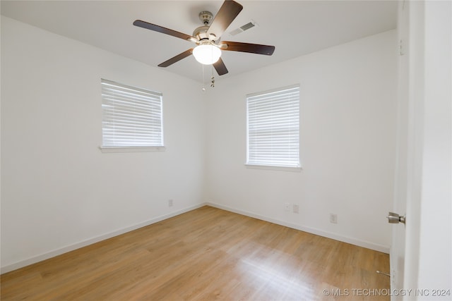 unfurnished room with ceiling fan and light hardwood / wood-style flooring