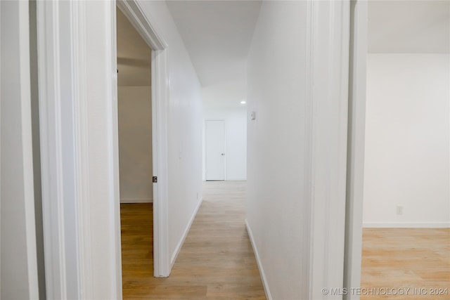 corridor featuring light hardwood / wood-style floors