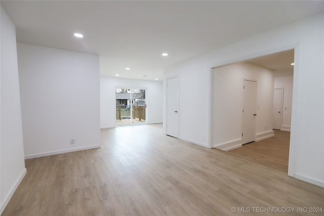 unfurnished room with light wood-type flooring