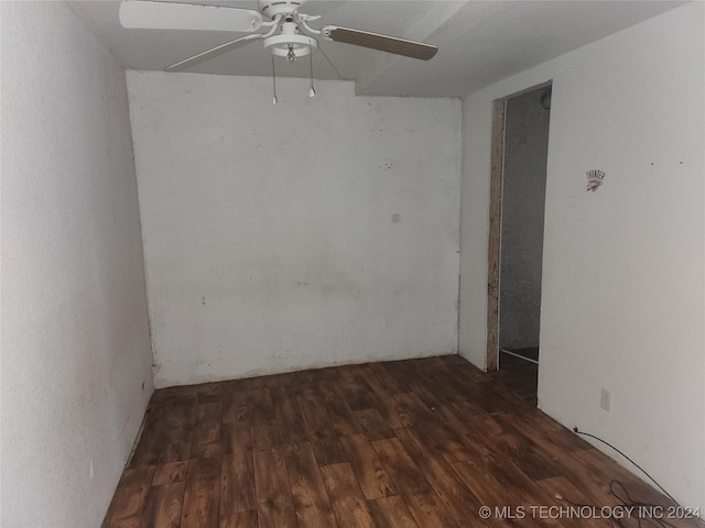 unfurnished room featuring dark hardwood / wood-style floors and ceiling fan