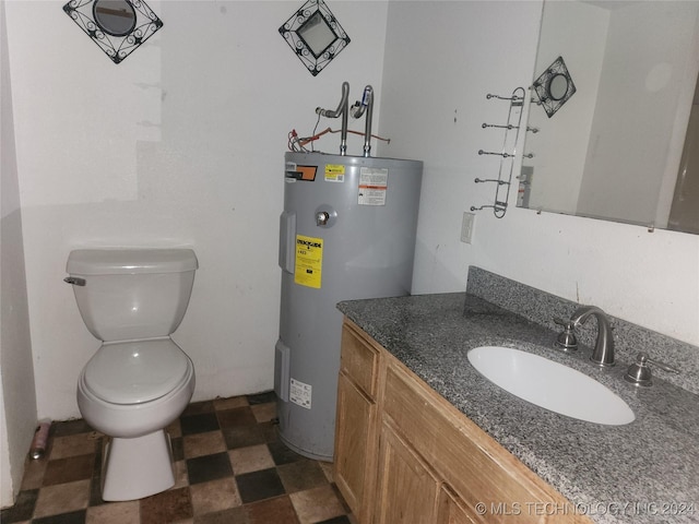 bathroom with vanity, toilet, and water heater