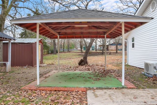 view of yard featuring a gazebo, a storage shed, and ac unit