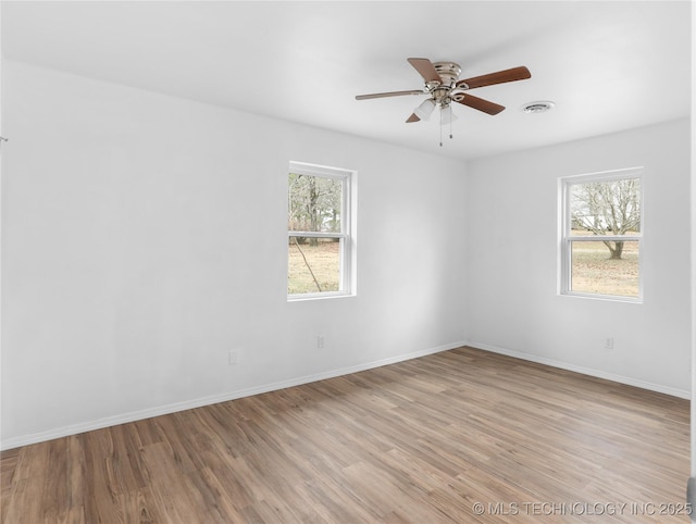 unfurnished room featuring light hardwood / wood-style floors and ceiling fan