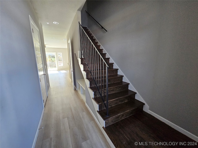 stairway with wood-type flooring