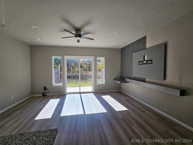 spare room with ceiling fan and dark hardwood / wood-style floors