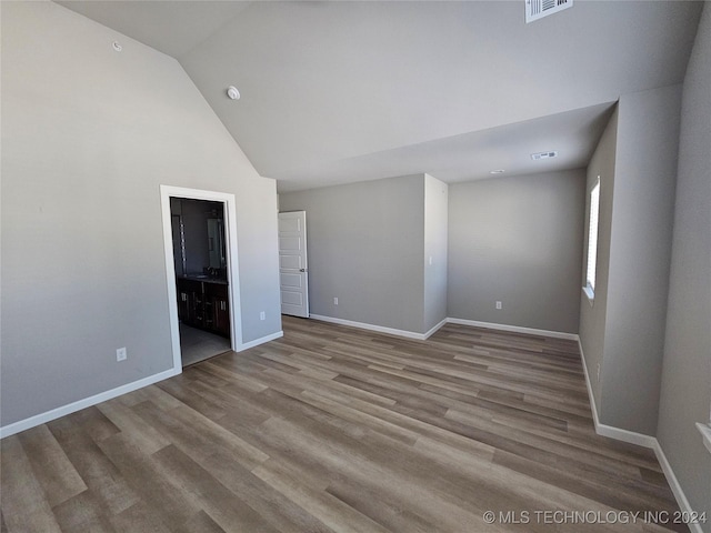 3406 Redbud Ln, Tulsa, OK 74132 - empty room with baseboards, visible vents, wood finished floors, and high vaulted ceiling