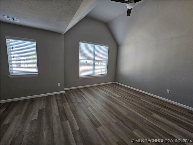3406 Redbud Ln, Tulsa, OK 74132 - bonus room featuring visible vents, lofted ceiling, baseboards, dark wood-type flooring, and a ceiling fan