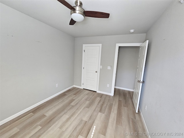 3406 Redbud Ln, Tulsa, OK 74132 - unfurnished bedroom with baseboards, a ceiling fan, and light wood finished floors