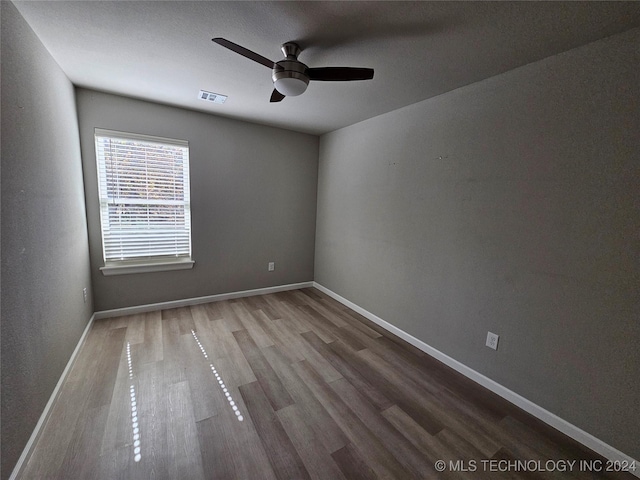 3406 Redbud Ln, Tulsa, OK 74132 - empty room with baseboards, ceiling fan, visible vents, and wood finished floors