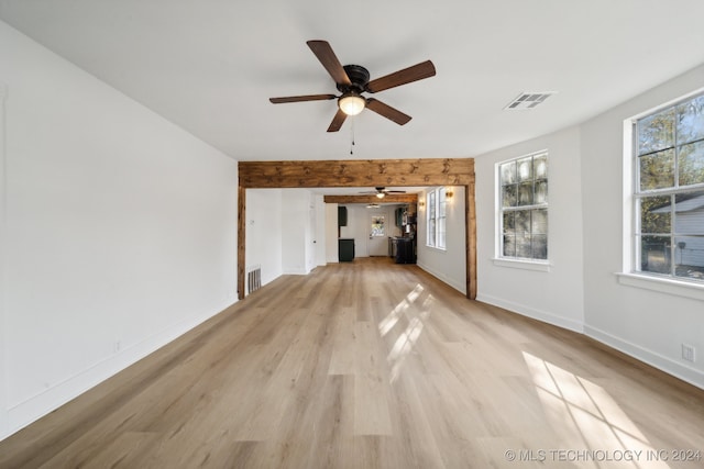 unfurnished living room featuring ceiling fan and light wood-type flooring