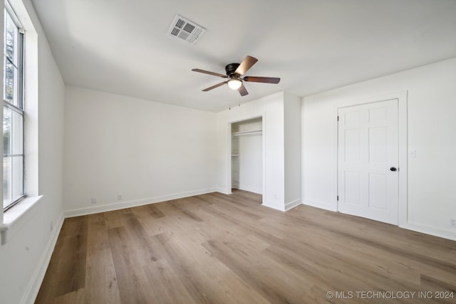 unfurnished bedroom featuring ceiling fan and light hardwood / wood-style flooring