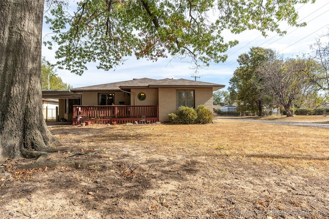 view of front of house featuring a wooden deck