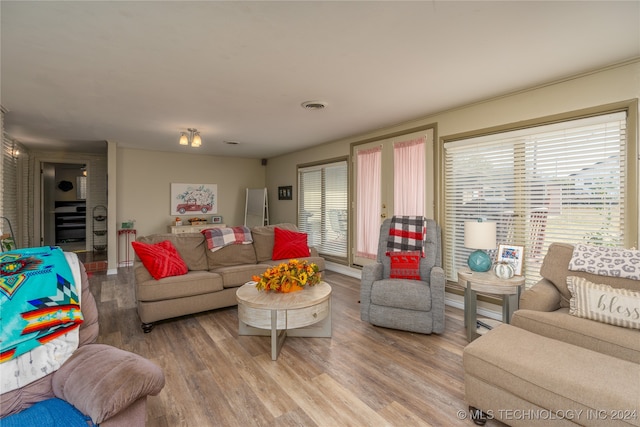 living room featuring light hardwood / wood-style flooring and a wealth of natural light