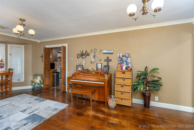 miscellaneous room with an inviting chandelier, dark hardwood / wood-style floors, and crown molding