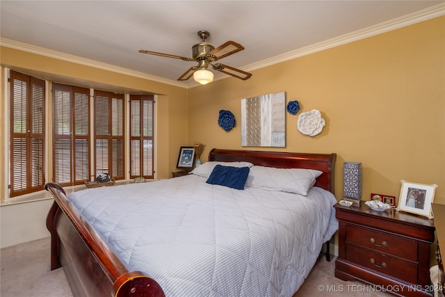 bedroom featuring crown molding, light colored carpet, and ceiling fan