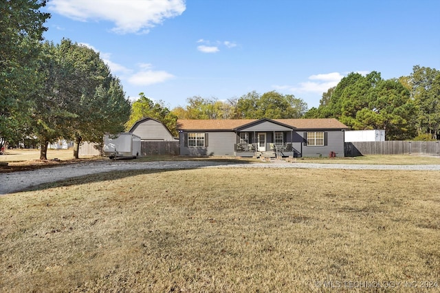 ranch-style home with a front yard